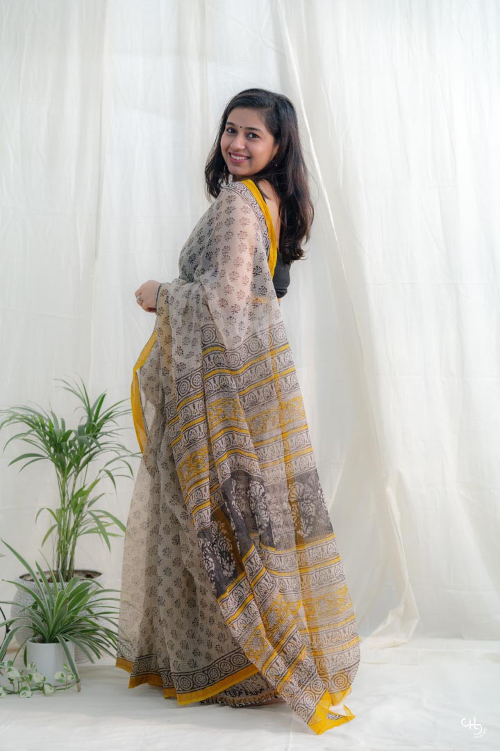 Beige and yellow kota doria saree